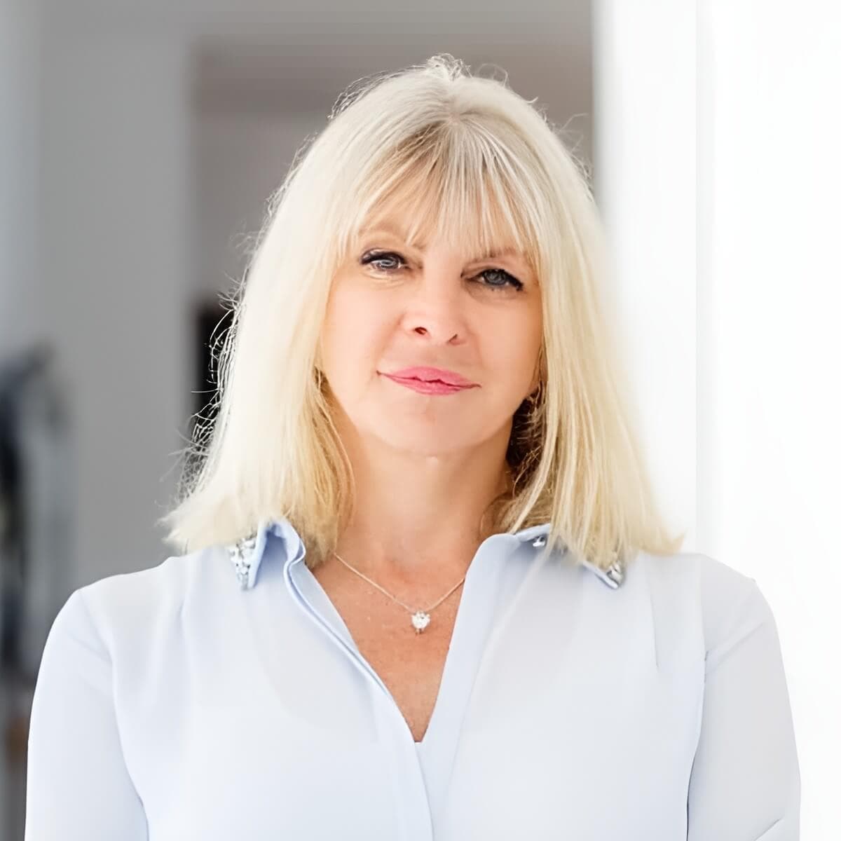 Professional headshot of Marisa Peer